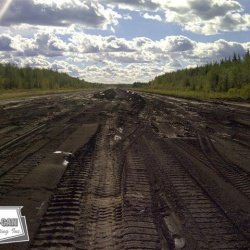 In this picture the asphalt runway has been removed. The asphalt millings that came off the runway were processed and used as base material for site improvements reducing the requirement for non renewable resources