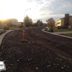 A road building project, prime coated and ready to be paved