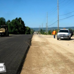 Paving recycled asphalt that has been recycled through the pugmill